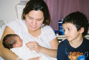 DeeDee introduces Rosario (age 3) to his newborn baby brother.